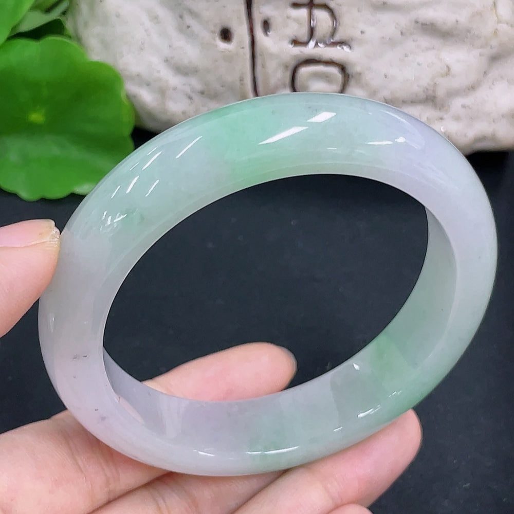 Jadeite round bangle with a 58mm size, weighing approximately 72g, featuring smooth, polished jadeite from HKHQ.