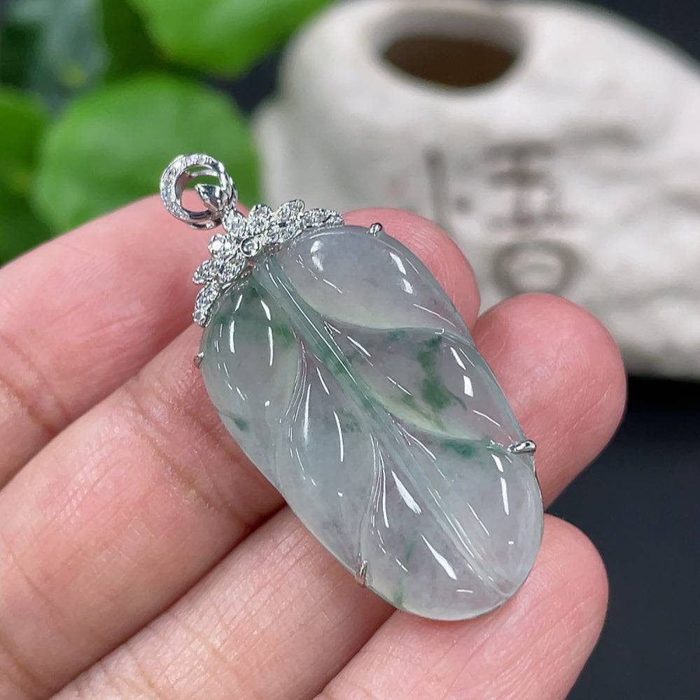 Jadeite leaf pendant in 18K gold setting with diamond accents, from HUILIU HQ, showcasing intricate design and elegant craftsmanship.