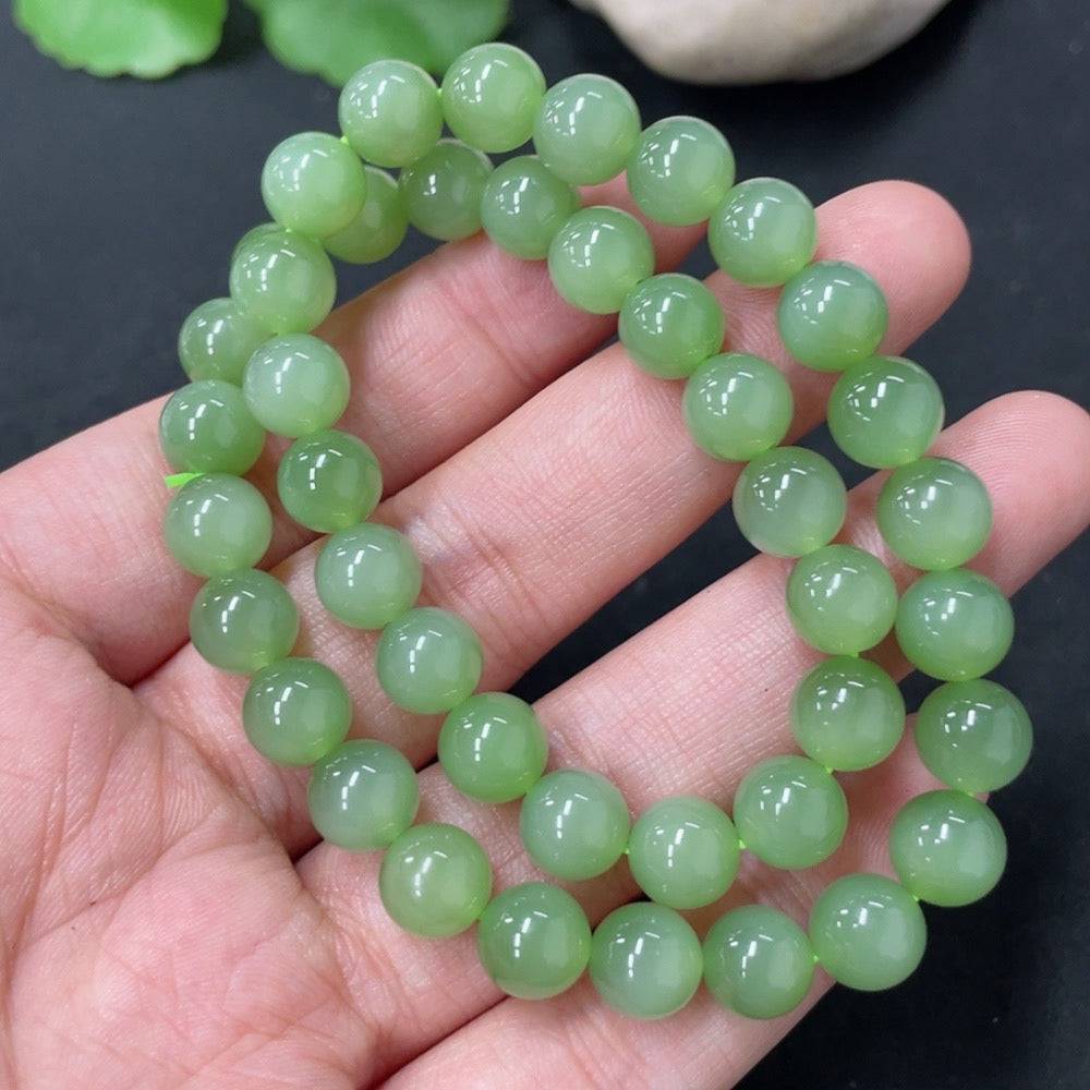 Hetian jade bead necklace with 7.6mm beads and a total weight of 33.6g, showcasing smooth, polished green jade stones.