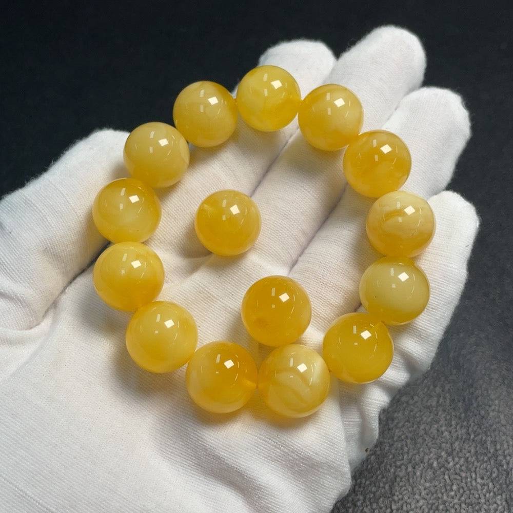Huiliu Amber beeswax bracelet with loose 14.6mm amber beads, natural and polished, certified by Huiliu HQ.