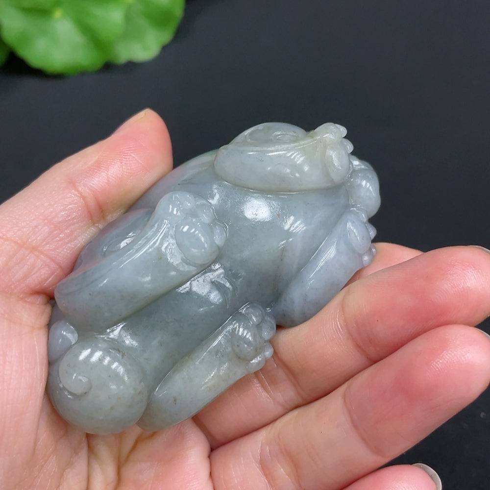 Huiliu certified Hetian jade handheld auspicious beast with smooth surface and intricate details, showcasing traditional craftsmanship.