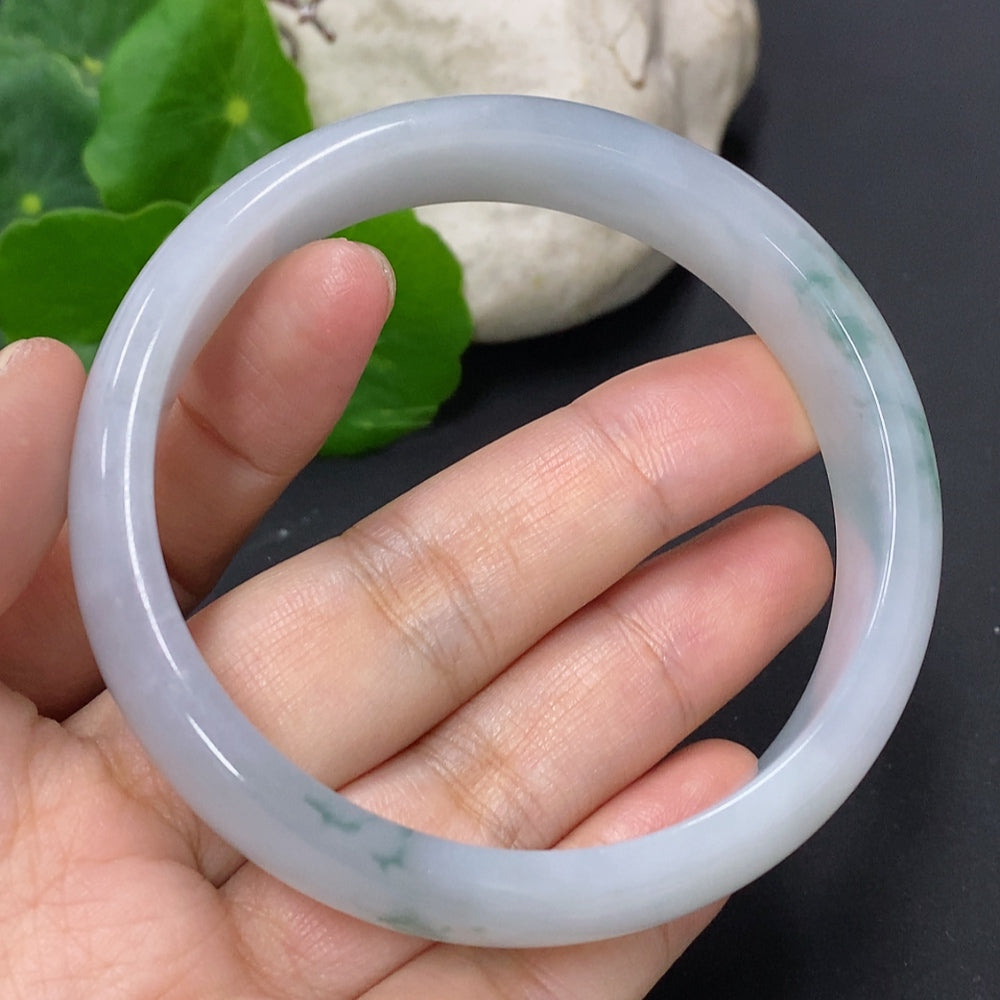 Jadeite round bangle in size 59.2, weighing approx. 52.4g, featuring smooth polished surface and vibrant green color.