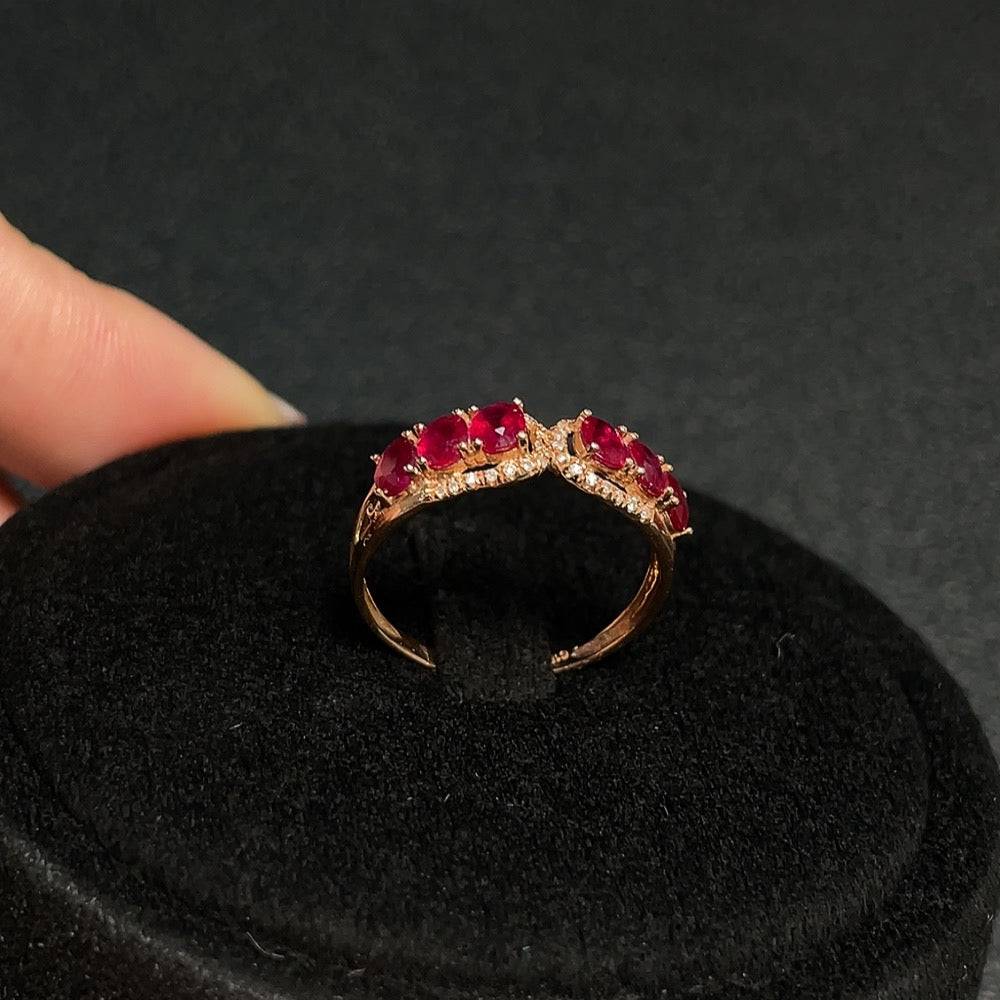 Huiliu Ruby ring with filled setting and diamond accents, showcasing vibrant red gemstones and intricate band design.