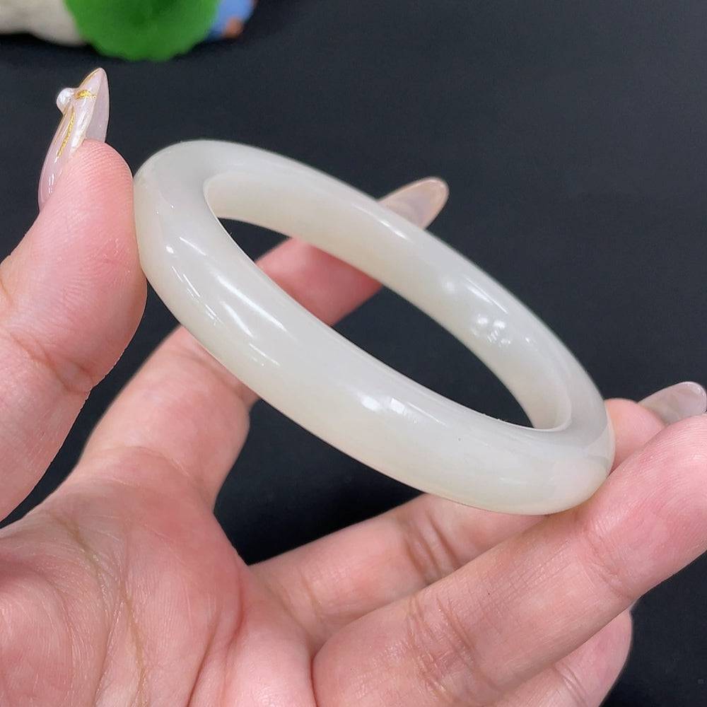 Huiliu certified Hetian jade round bracelet featuring smooth, polished green jade beads on a string, elegant and natural jewelry.