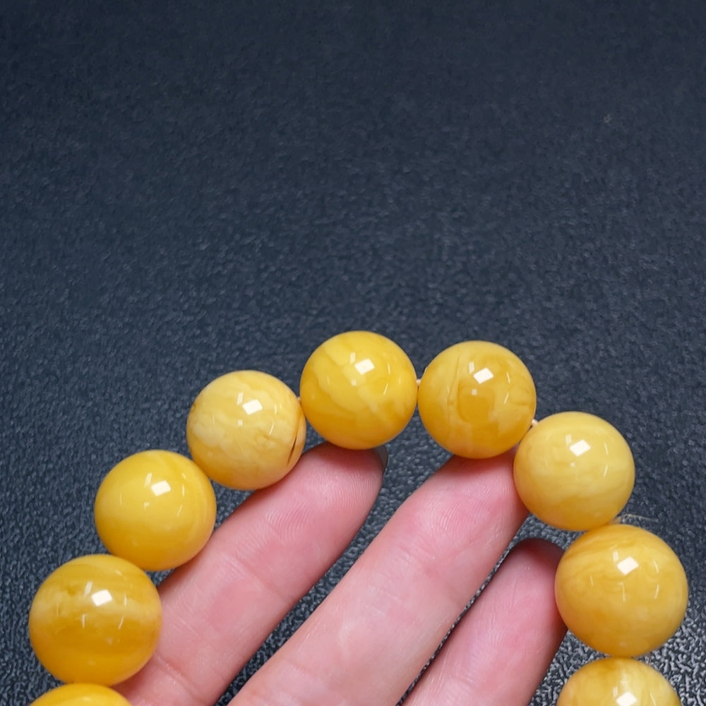 Huiliu Amber Beeswax Bracelet with 15.9mm amber beads, natural honey-colored, handcrafted jewelry, certified by Huiliu HQ.