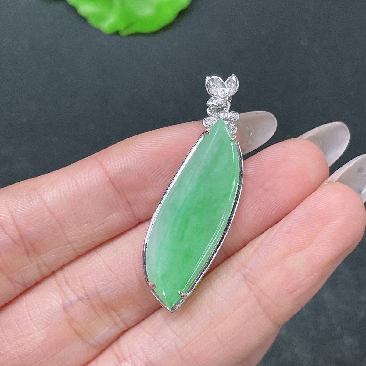 Huiliu Jadeite pendant with Fu Gua symbol, accented with diamonds, in a polished jade jewelry set.