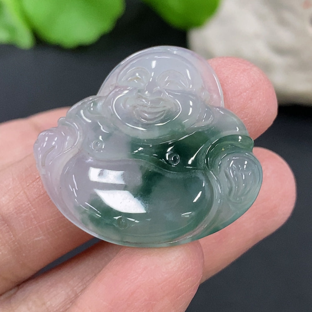 Jadeite Buddha pendant in green jade, featuring intricate carvings, suspended on a cord, designed by HKHQ.