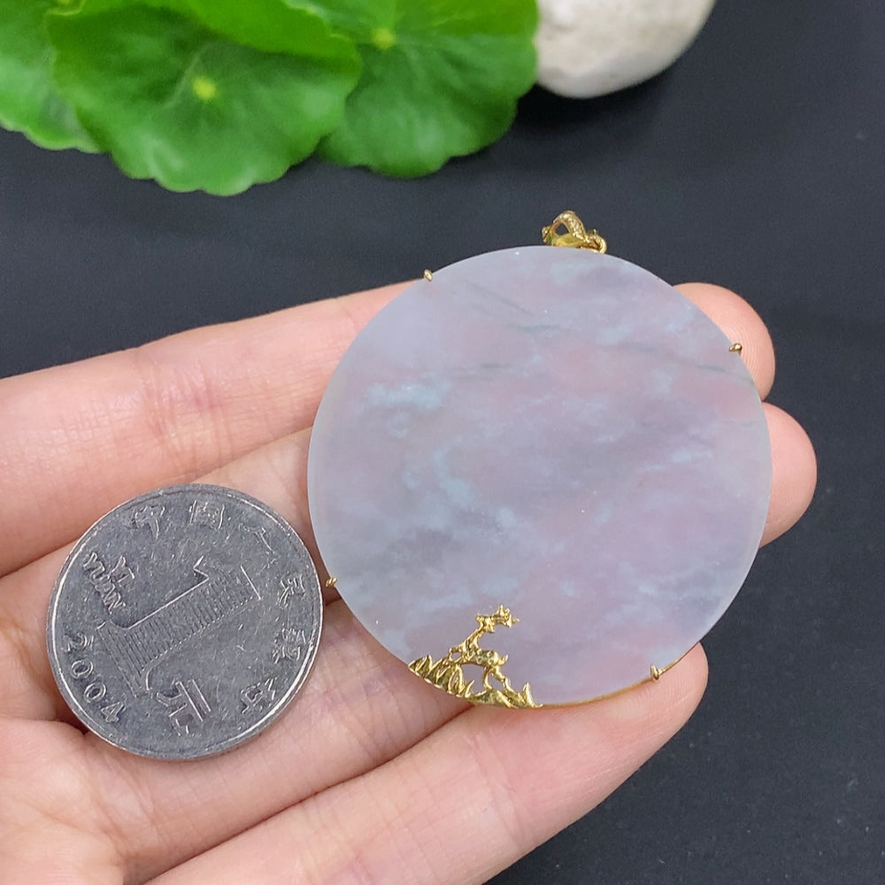 Elegant jadeite pendant with diamond accents on an 18K gold necklace, showcasing a smooth, polished design.