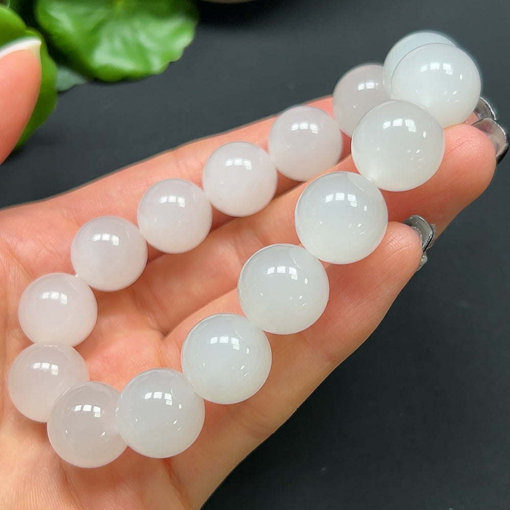 HKHQ Hetian Jade bracelet, 14mm round beads, elegant jewelry piece showcasing smooth, polished green jade stones.
