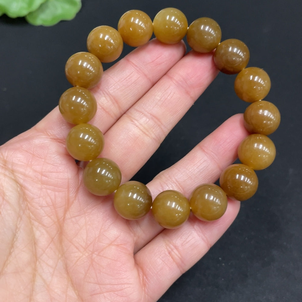 Hetian Jade bracelet by HUILIU HQ with 11.6mm beads and a total weight of 42g, showcasing smooth, polished green jade stones.