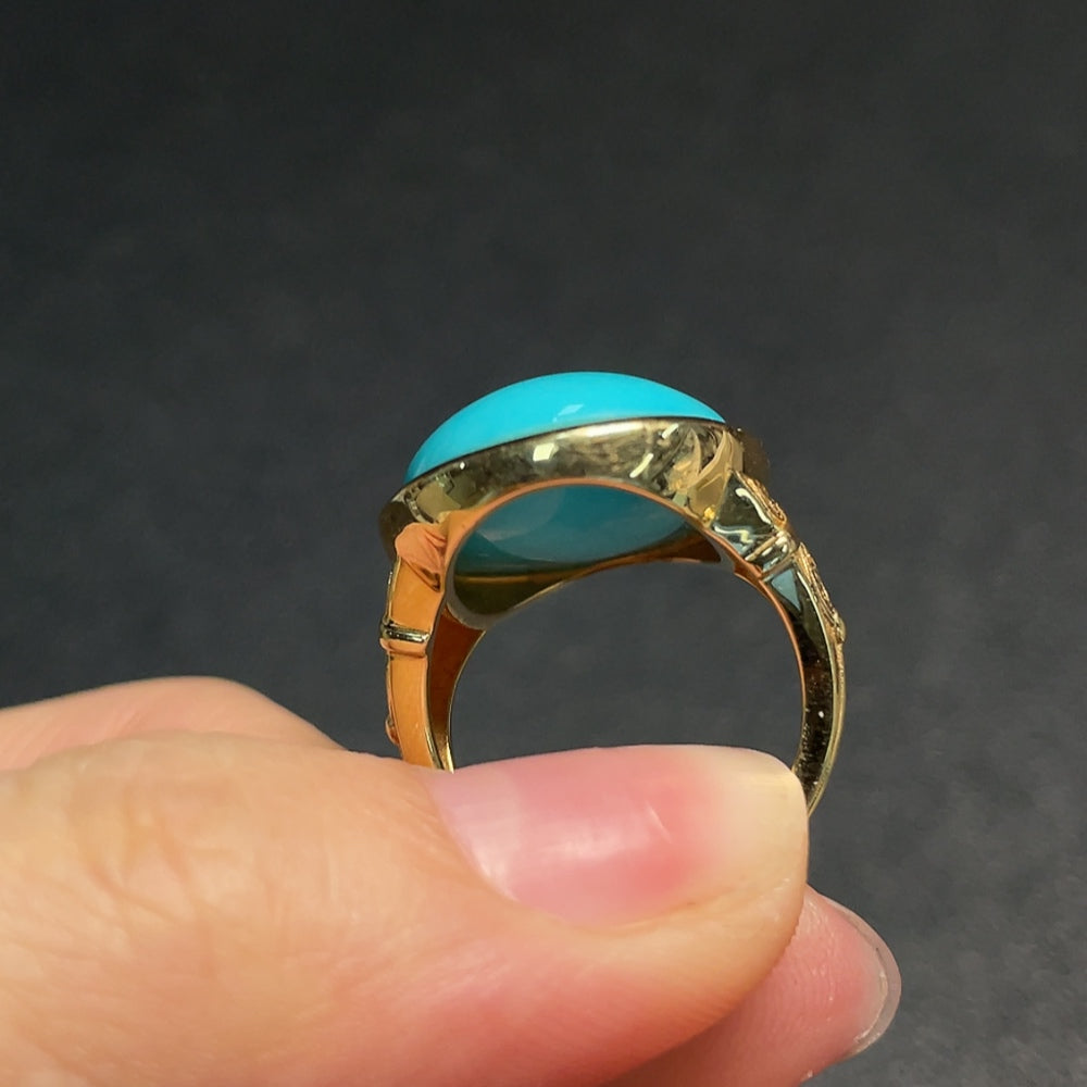 Huiliu gemstone turquoise ring featuring a vibrant blue-green gemstone with no hallmark, set in a simple band.