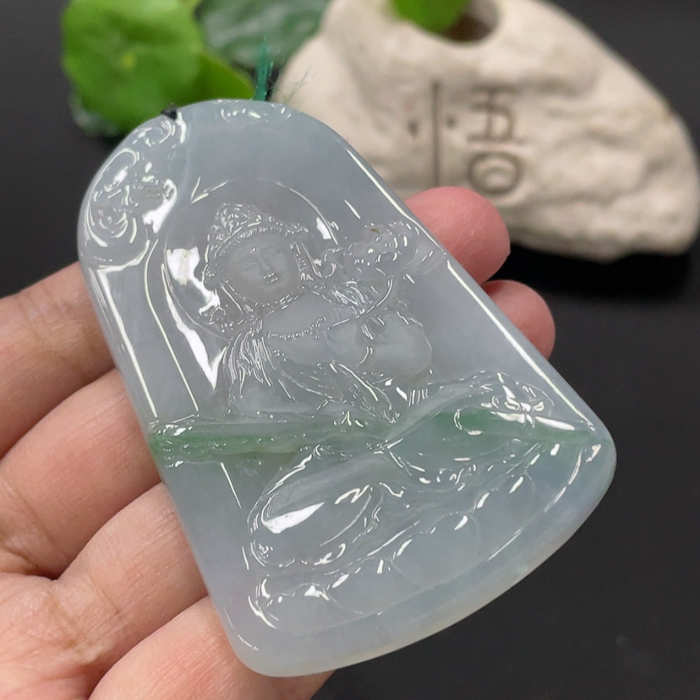 Jadeite Guanyin pendant from HUILIU HQ, carved jade with detailed figure, weighing approximately 51.47 grams.