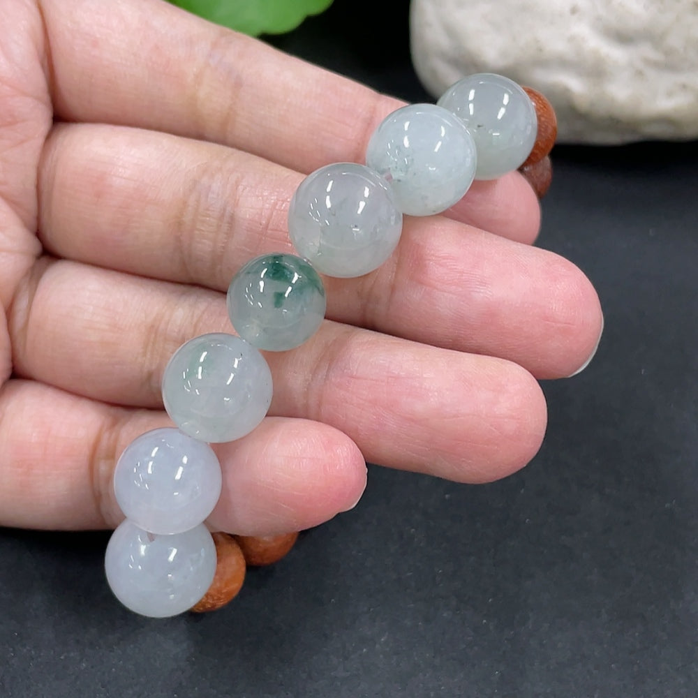 Jadeite and wood bead bracelet with 12.2mm beads, weighing 23.8g, featuring green jade and natural wood beads.