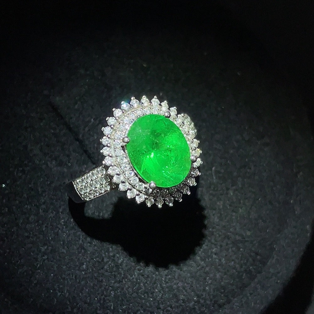 Emerald set ring with gemstones in 18K gold, size 15, featuring clarity-enhanced emeralds and a total weight of 4.39g.