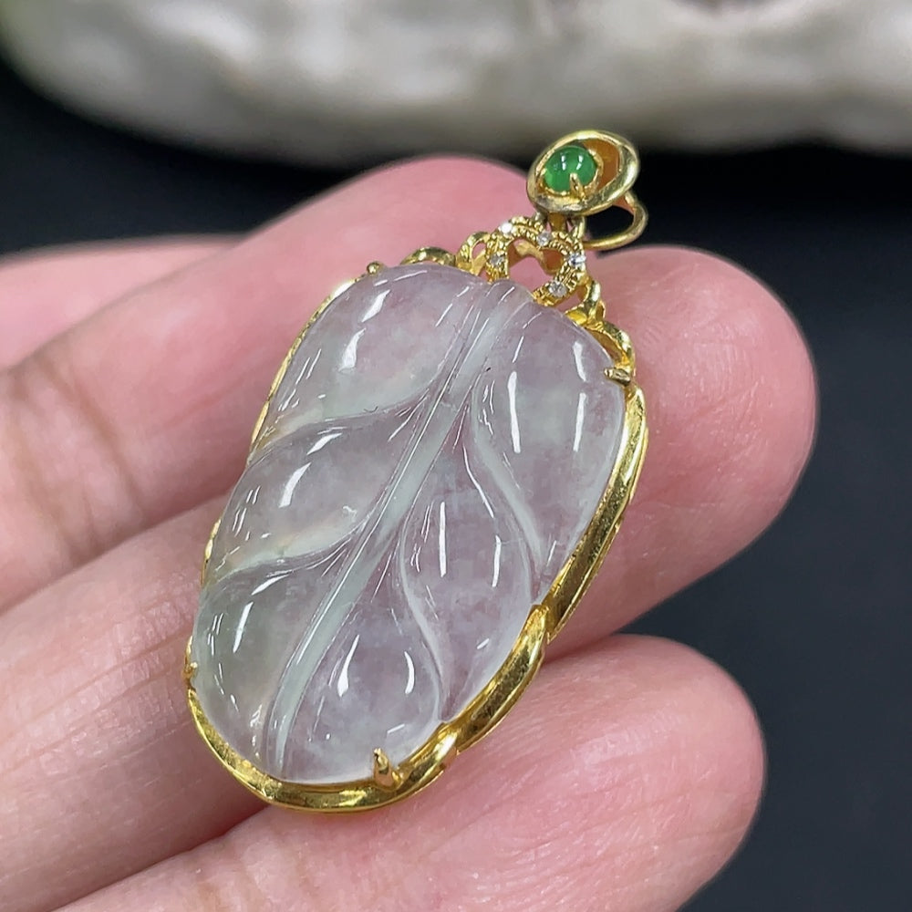 Jadeite leaf pendant in 18k gold with diamond inlay, crafted by HKHQ, weighing approx. 2.17g, detailed close-up of the jewelry piece