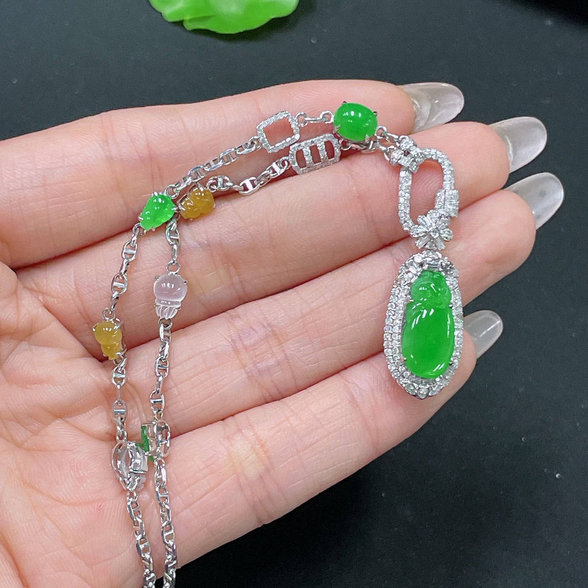 HUILIU HQ jadeite necklace with 18k gold and diamond accents, featuring a polished jade pendant on a gold chain.