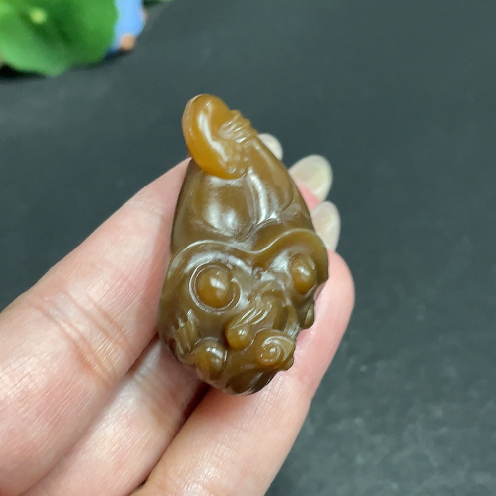 Hetian Jade pendant with quacking for wealth design, crafted by HKHQ, weighing approximately 26.7g, displayed on a neutral background.