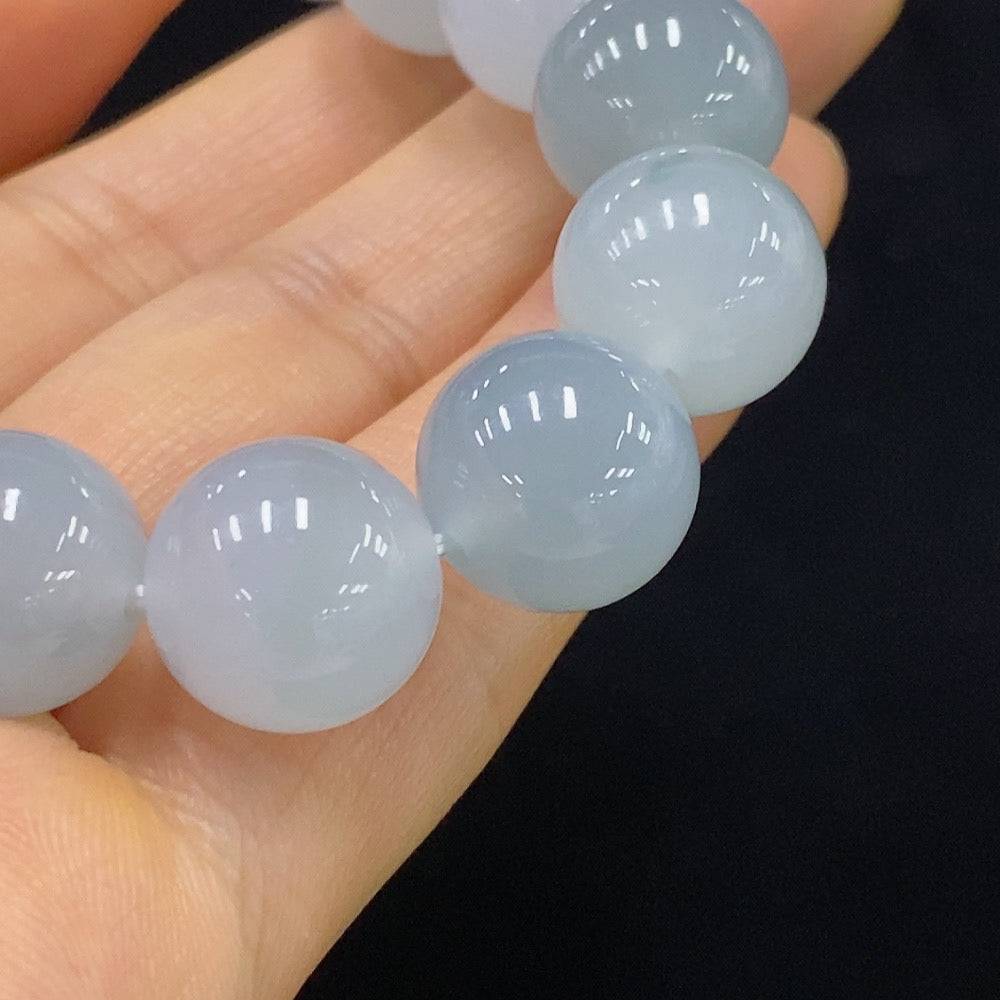 HUILIU HQ jadeite bracelet with 12.1mm beads, approximately 51.08g, showcasing smooth, polished jade stones on a white background