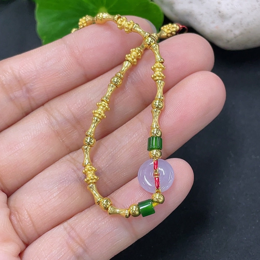 Jadeite inlaid bracelet with mixed gold components, featuring intricate design and elegant craftsmanship by HKHQ.