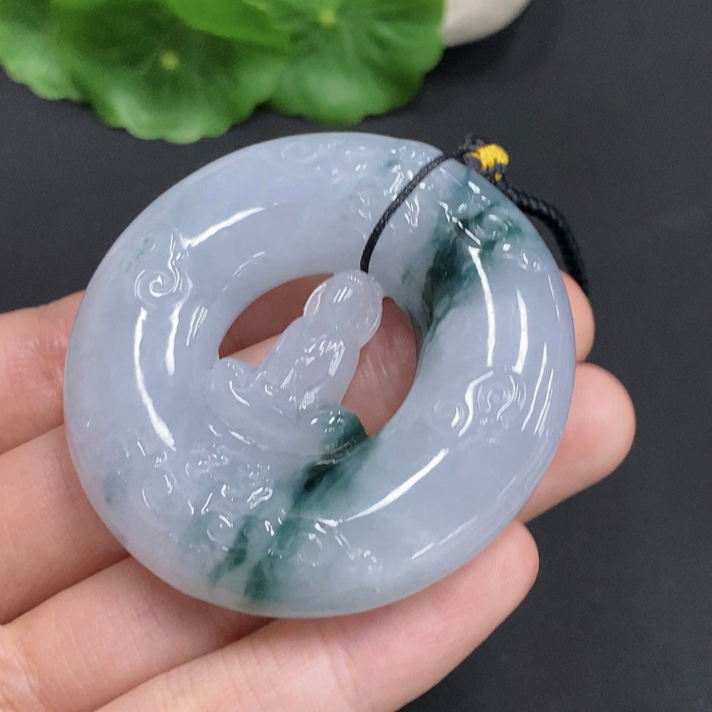 Huiliu Jadeite Enlightenment Pendant featuring smooth, polished green jade with Huiliu certification, hanging from a delicate cord.