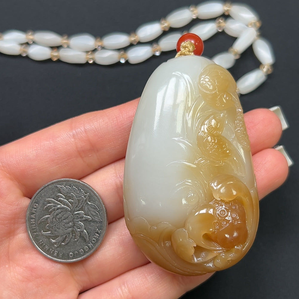 Hetian Jade "Joy on the Brow" pendant necklace with non-Hetian beads, featuring a detailed jade pendant and beaded chain.