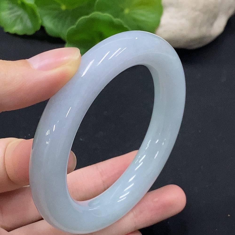 Huiliu certified jadeite round bangle showcasing smooth, polished jade with a natural green hue and elegant design.