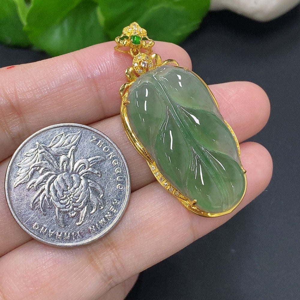 Jadeite leaf pendant with 18K gold accents and diamond details, weighing approximately 5.8g, designed by HKHQ.