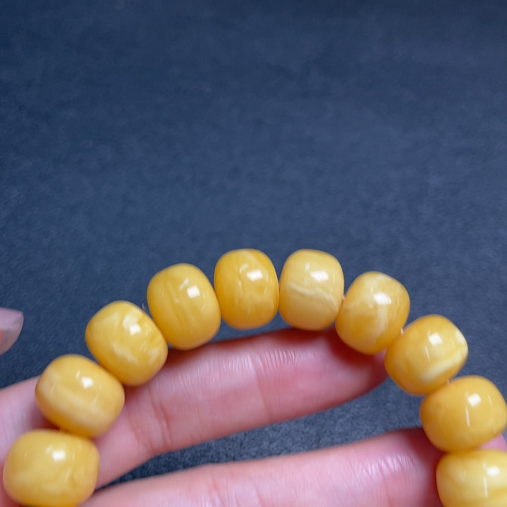Huiliu Amber Beeswax bracelet with 12.4mm size beads, natural amber color, handcrafted jewelry, certified by HUILIU HQ.