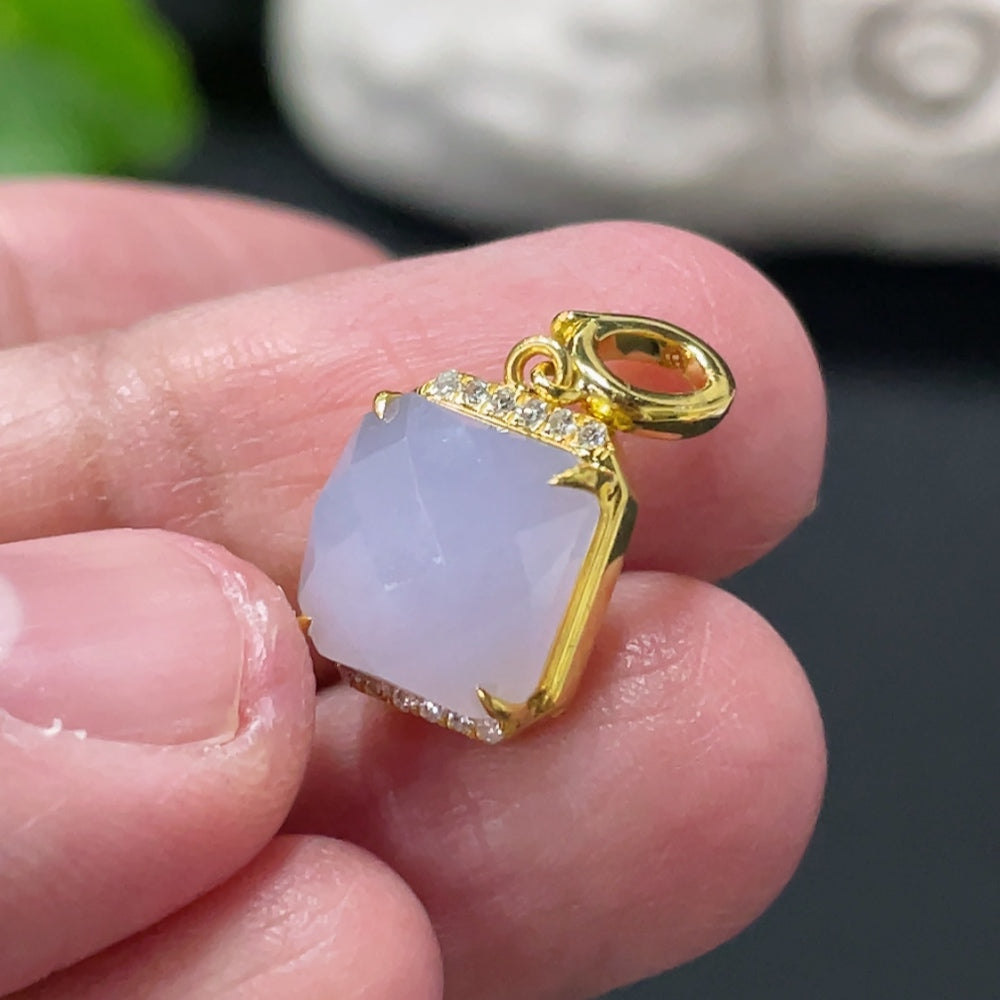 Huiliu Jadeite pendant with diamond accents, mounted on a silver setting, showcasing a polished green jade gemstone.