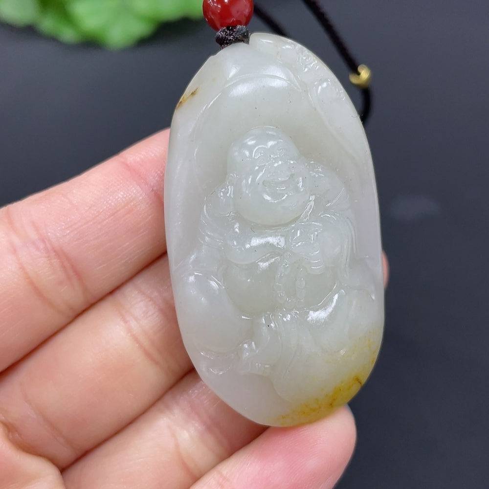 Huiliu Hetian jade pendant featuring a Buddha figure, intricately carved in smooth green jade, certified by Huiliu HQ.