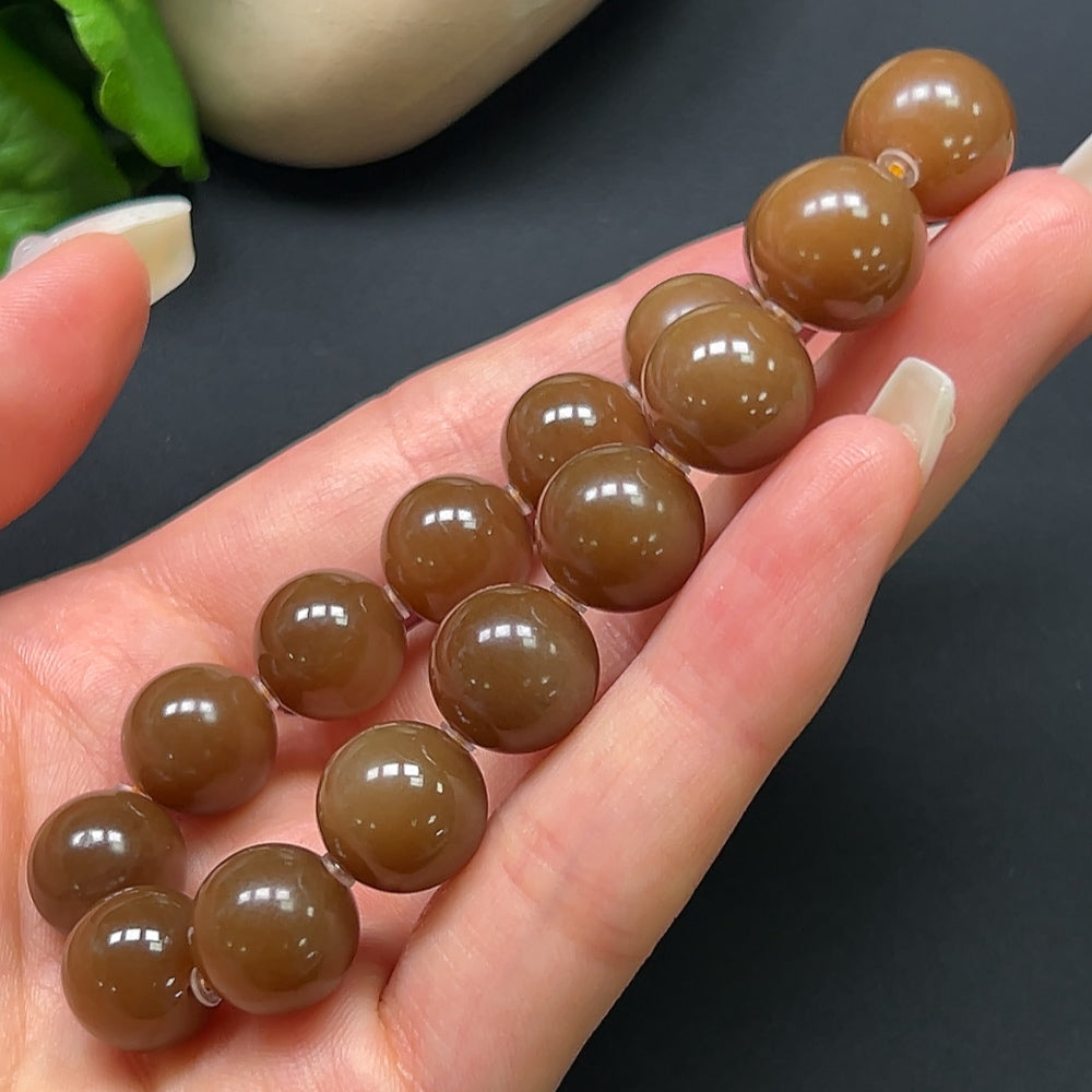 Hetian jade bracelet with 12.1mm beads, weighing approximately 43.69g, crafted by HKHQ, showcasing smooth, polished jade stones.