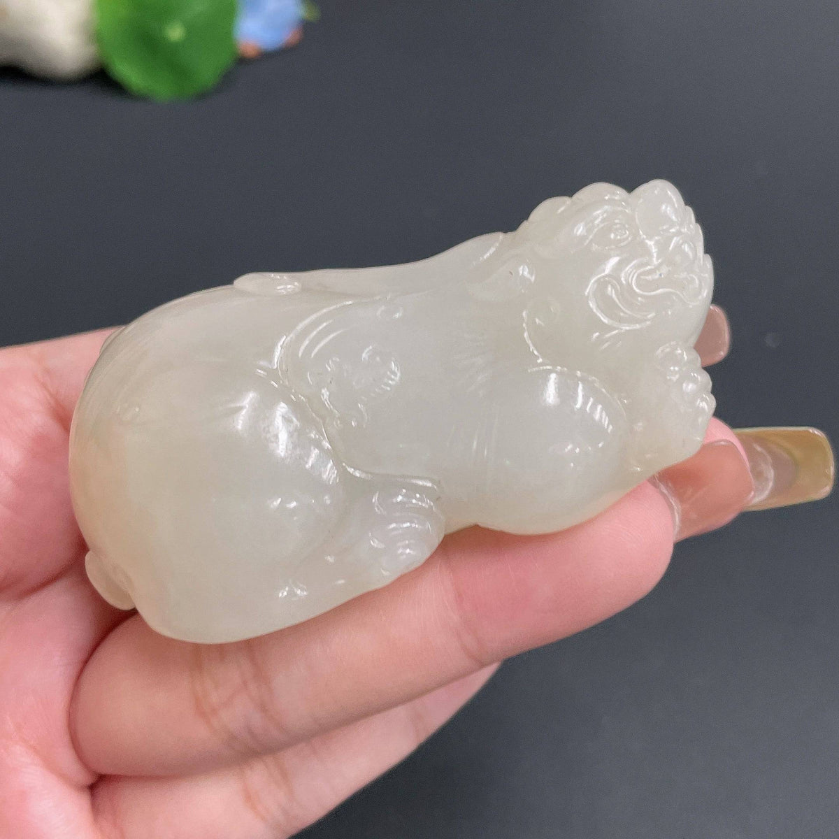 Huiliu Certified Hetian Jade Handheld Pi Xiu figurine, traditional Chinese jade carving with intricate details and smooth surface.