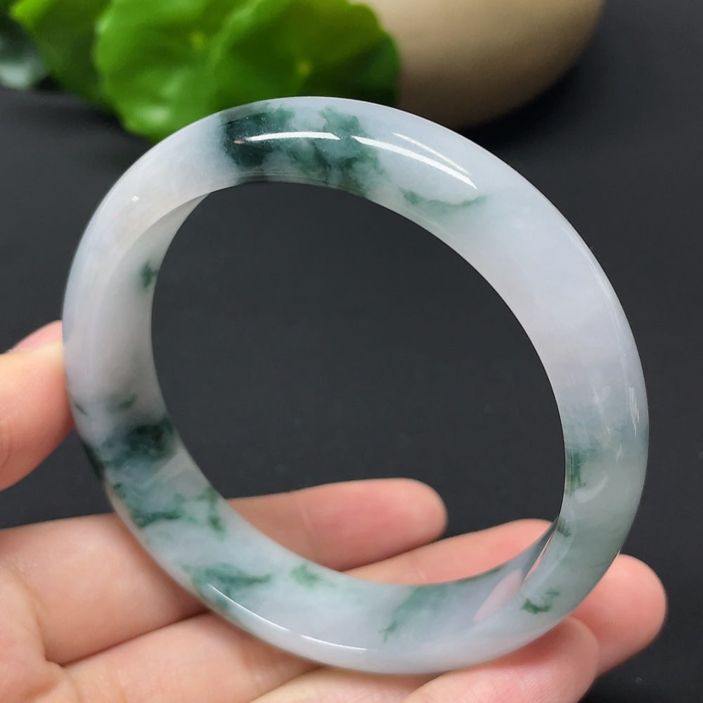 HKHQ jadeite round bangle with mineral components, weighing approximately 54.31g and size 57.9, featuring smooth, polished surface.