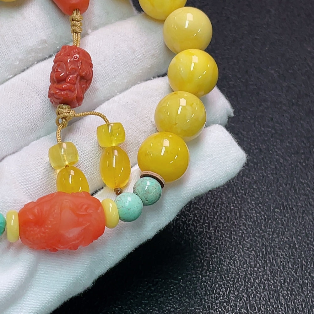 Amber and beeswax bracelet featuring a 13mm Southern Red Agate stone, crafted by HUILIU HQ, Huiliu Certified.