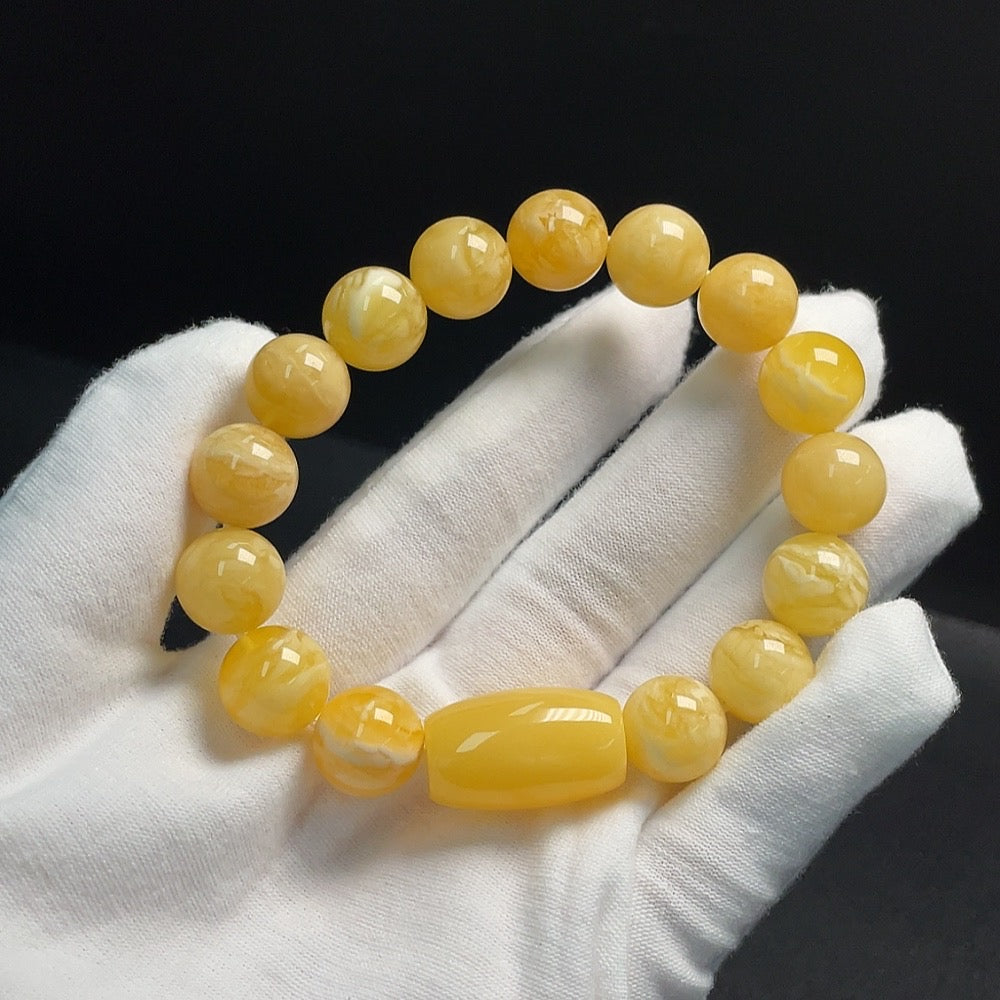 Huiliu Certified amber beeswax bracelet with about 12.1mm size, featuring warm amber beads on a stretch cord.