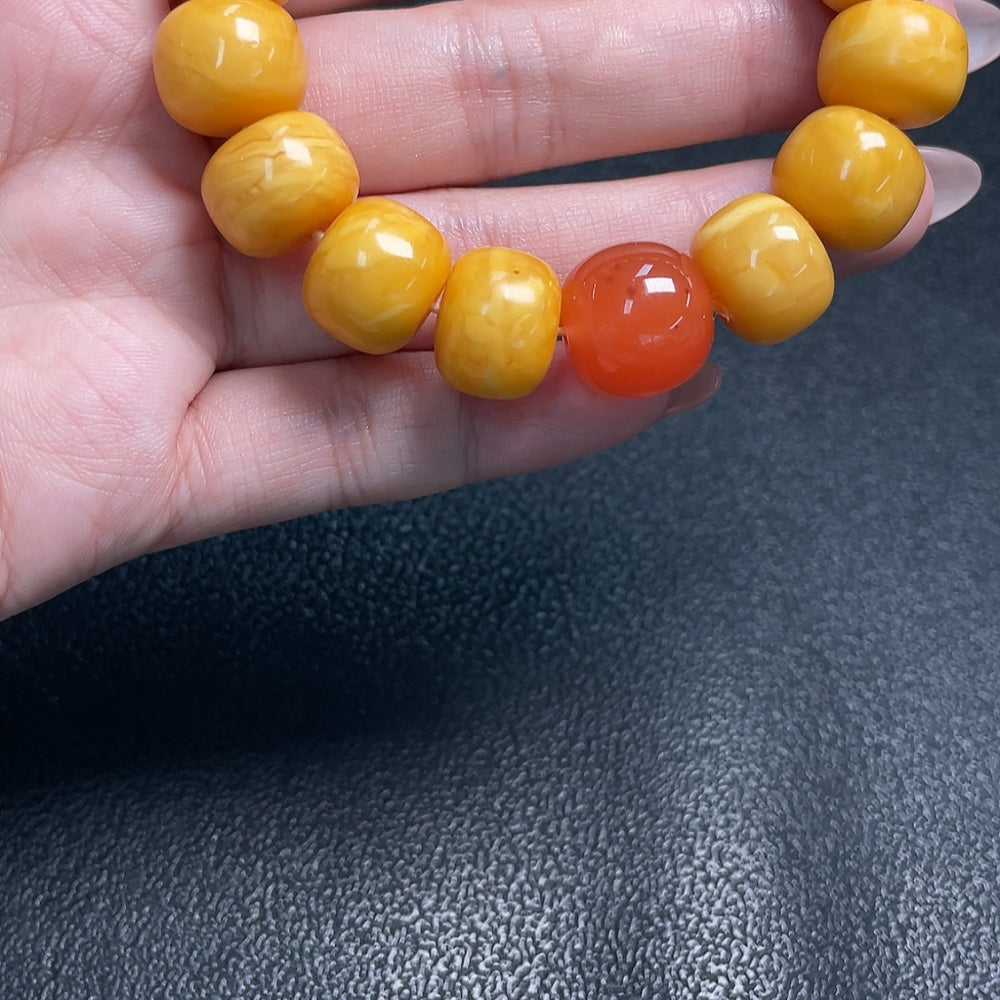 Amber Beeswax Bracelet by HUILIU HQ featuring bead details and Southern Red Agate accents with natural amber and beeswax.