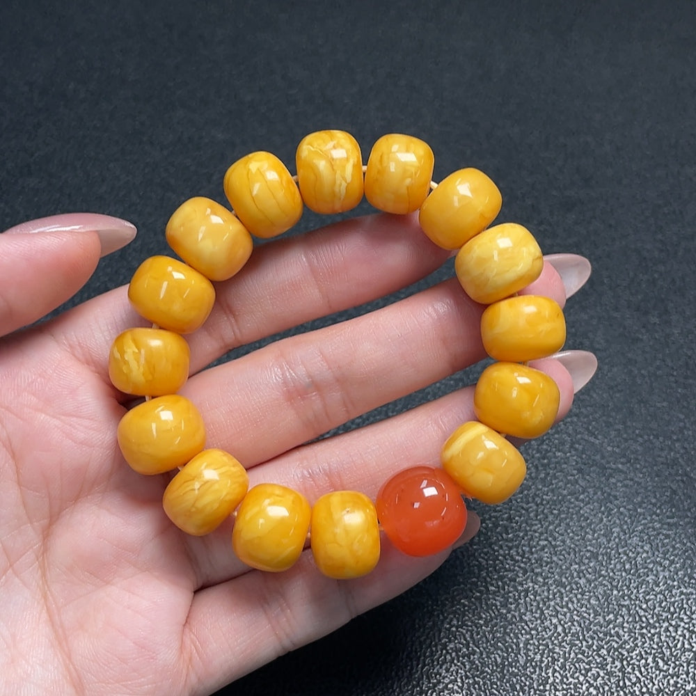 Amber Beeswax Bracelet by HUILIU HQ featuring bead accents and a Southern Red Agate stone, natural and handcrafted jewelry piece.