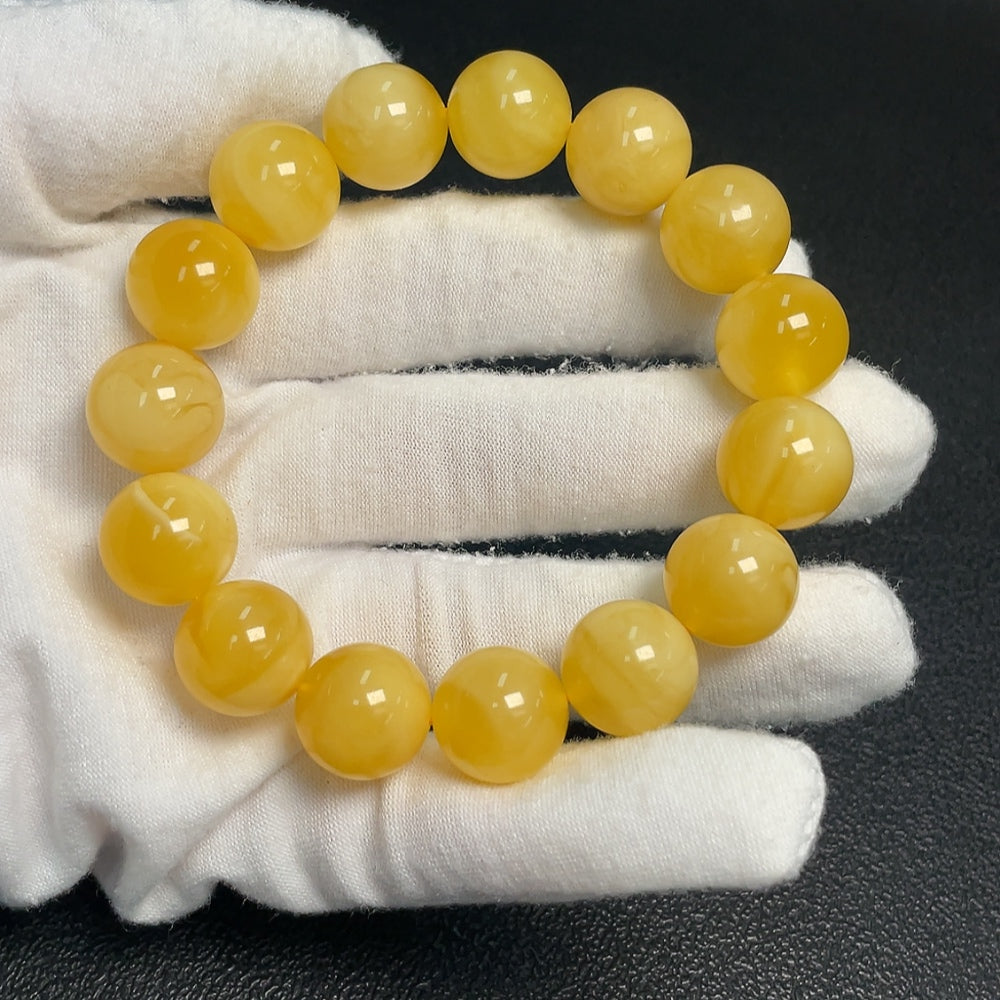 Huiliu certified amber beeswax bracelet, 14.1mm size, featuring natural amber beads on a flexible string.
