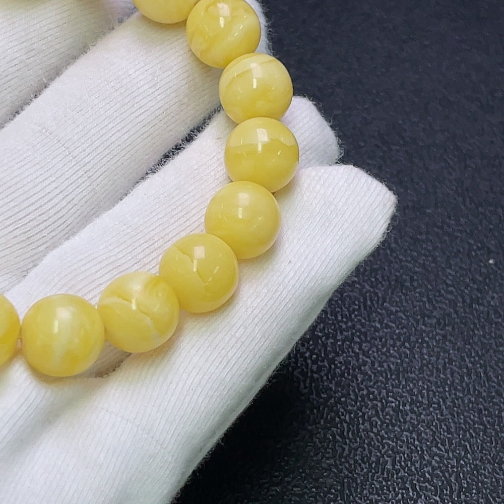 Huiliu HQ amber beeswax bracelet with 10.6mm size, natural amber beads, and Huiliu certified quality.