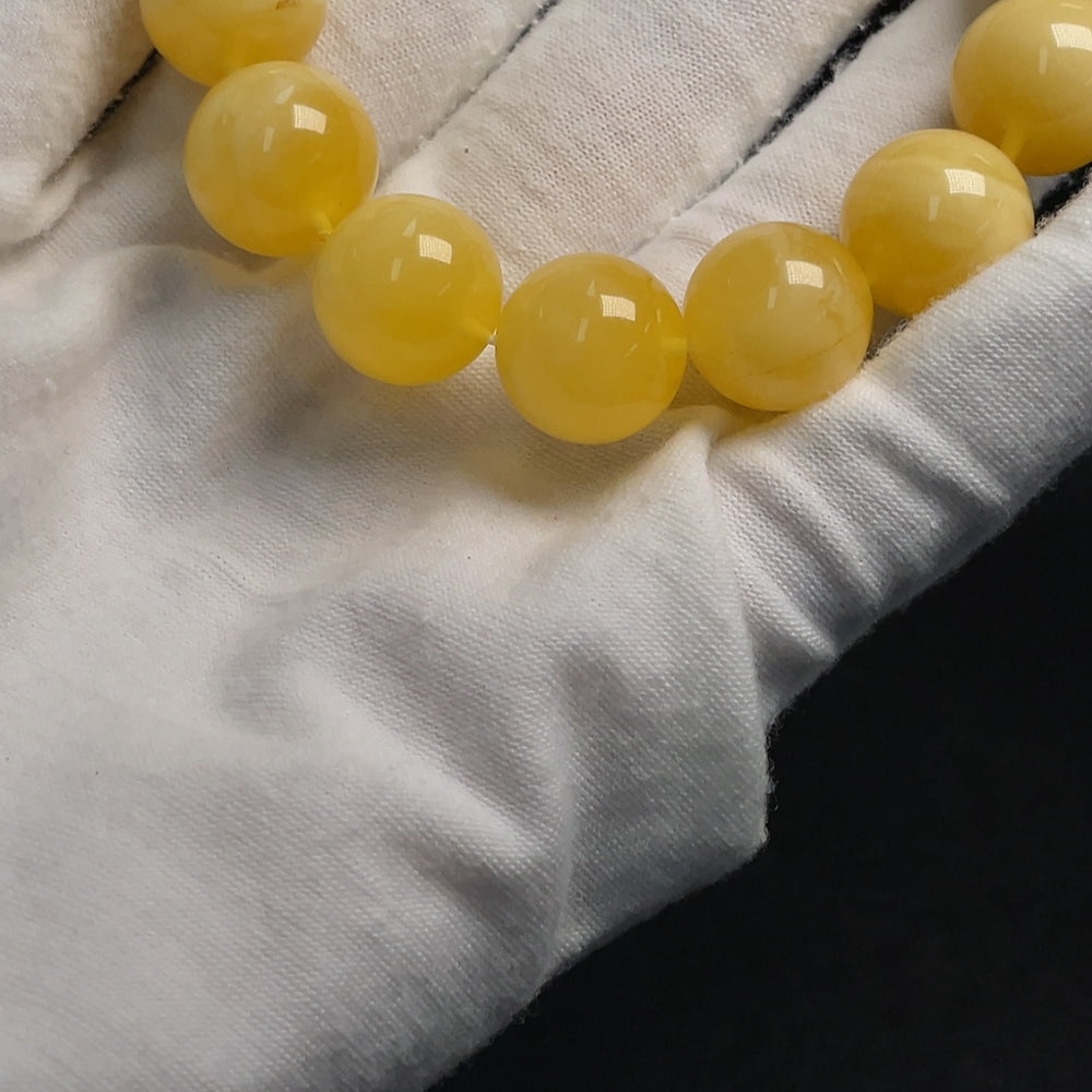 Huiliu HQ Amber Beeswax Bracelet, 14.1mm size, natural amber jewelry with warm honey tones and smooth polished finish.