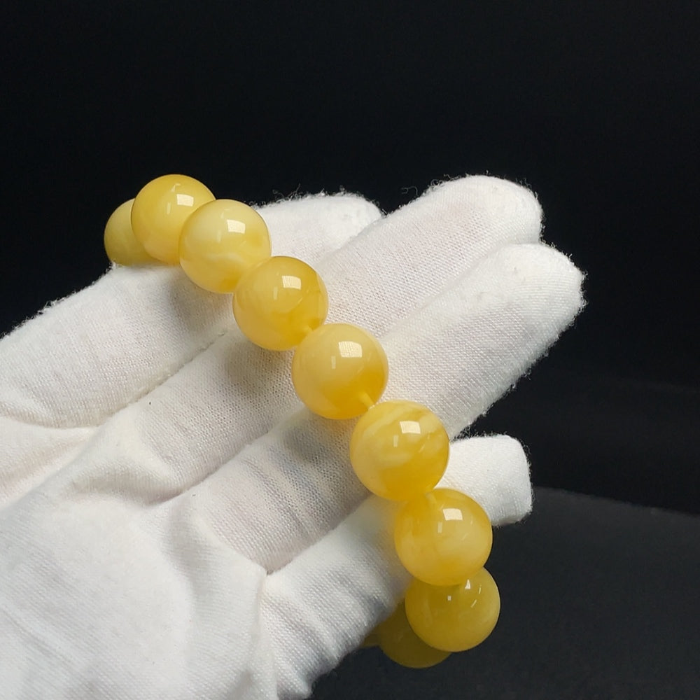 Amber Beeswax Bracelet from HUILIU HQ featuring a 14.1mm amber bead, natural beeswax appearance, and certified quality.