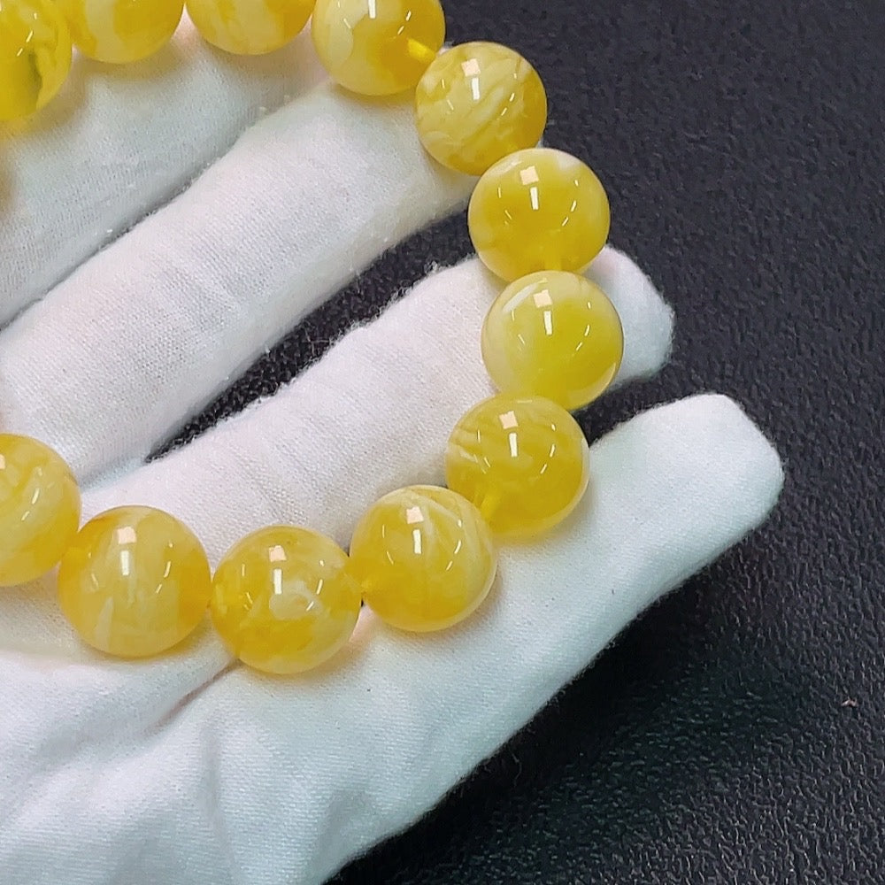 Amber Beeswax Bracelet by HUILIU HQ, about 13.8mm in size, featuring natural amber beads and Huiliu certification.