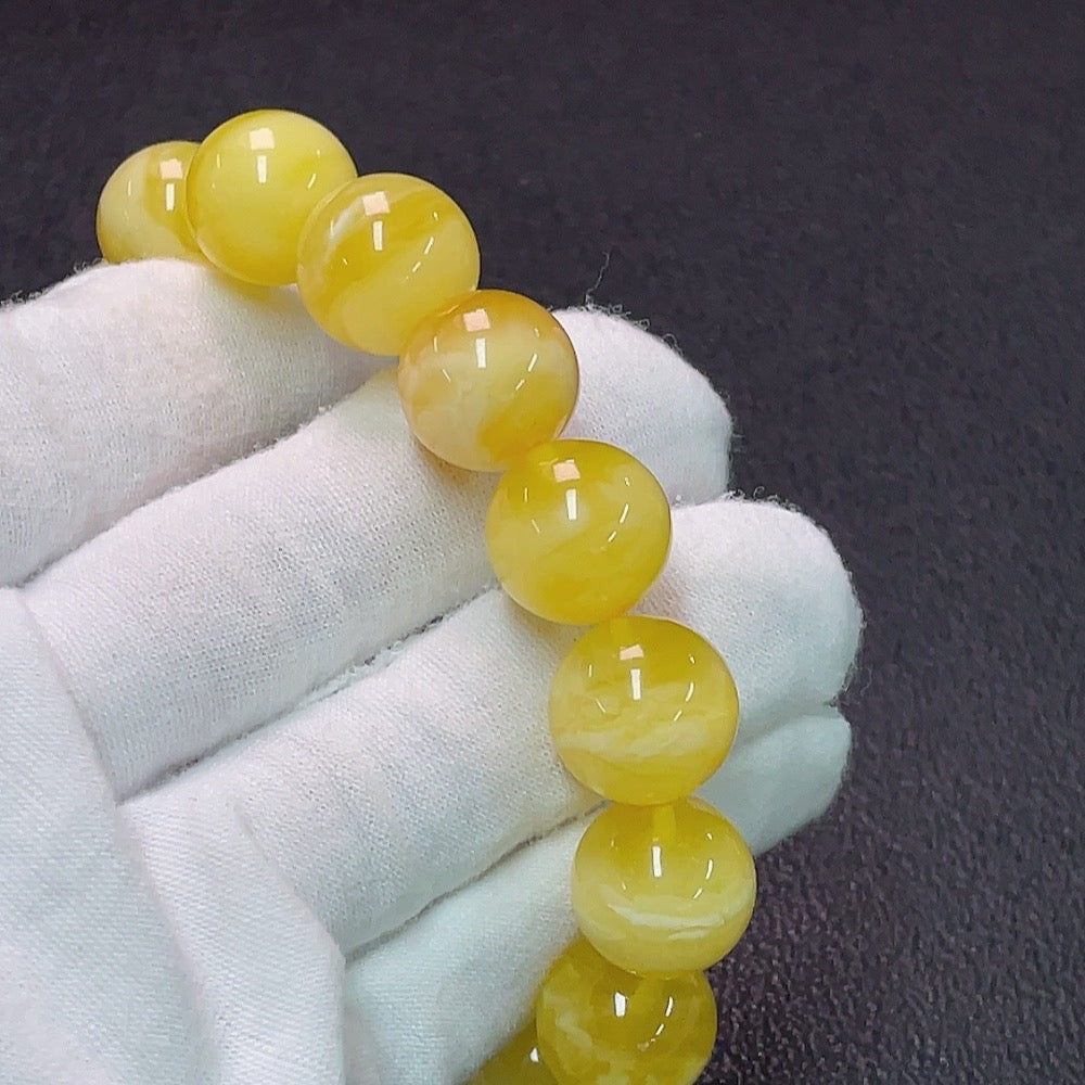 Amber Beeswax Bracelet by HUILIU HQ, about 13.8mm in size, featuring natural amber beads and Huiliu certification.