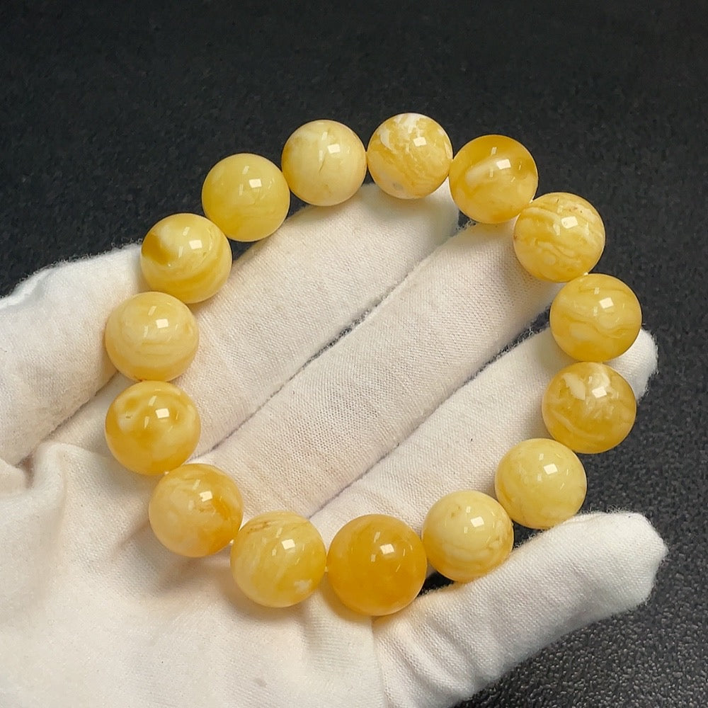 Amber Beeswax Bracelet by HUILIU HQ featuring natural amber beads weighing 24.33g and measuring 14.2mm in size.