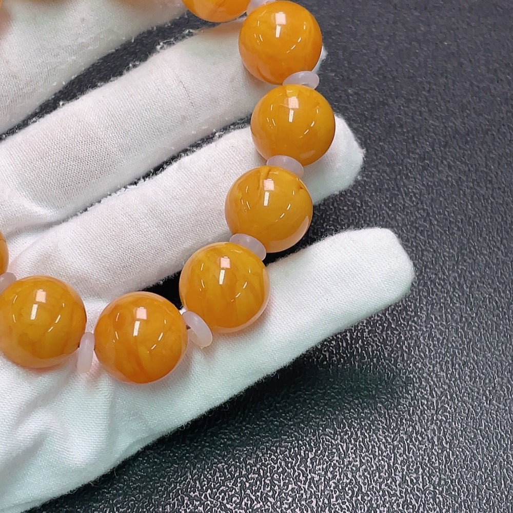Amber Honey Wax Bracelet by HUILIU HQ, 16mm size with visible partial repairs, stones may not be natural, weighs approx. 31.9g.