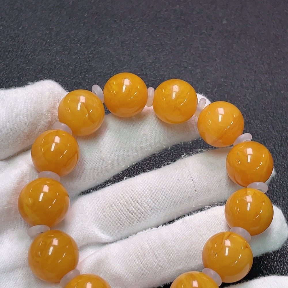 Amber Honey Wax Bracelet by HUILIU HQ with visible partial repairs, 16mm size and approx. 31.9g weight, featuring amber stones.