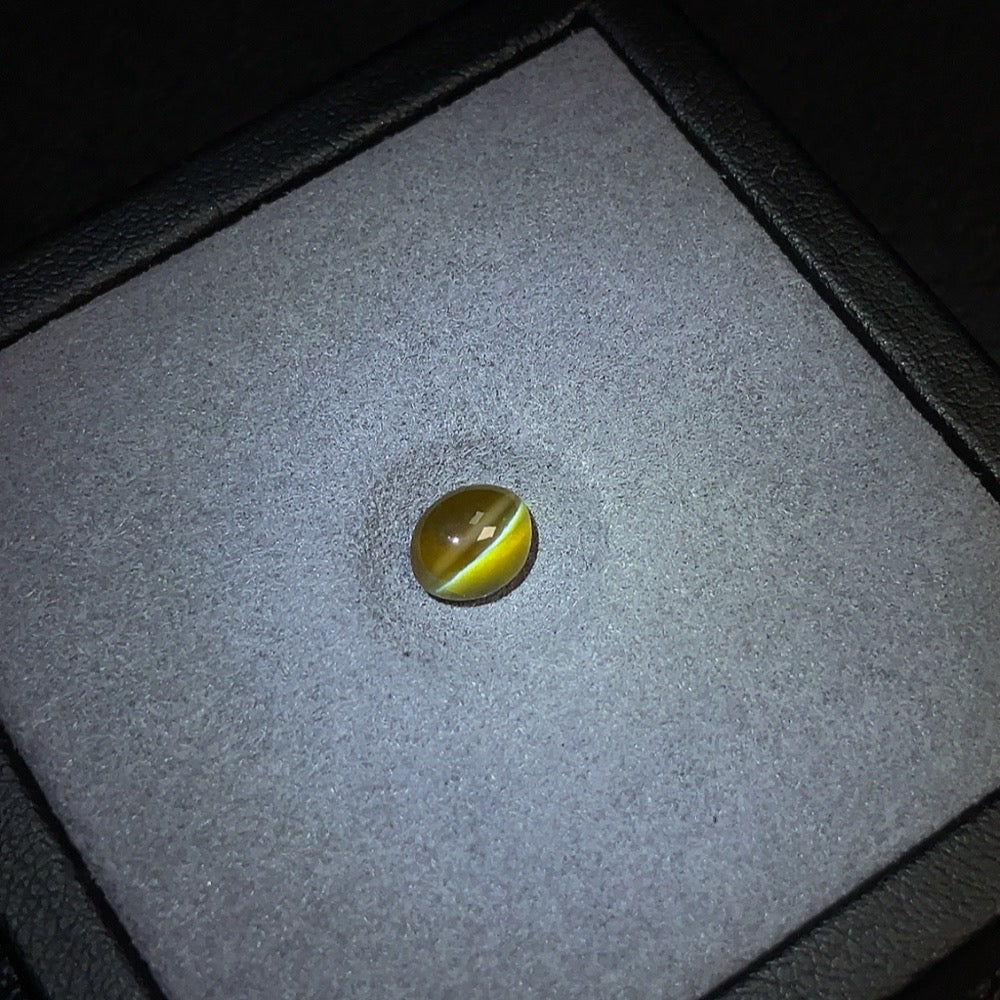 Chrysoberyl loose gemstone by HUILIU HQ, 1.74 carats, sparkling natural gemstone with vibrant green and yellow hues.