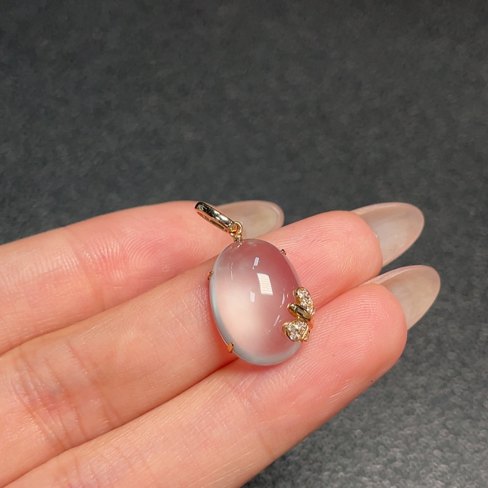 Huiliu certified prehnite pendant with diamond accents, showcasing a polished green gemstone and sparkling diamond details.