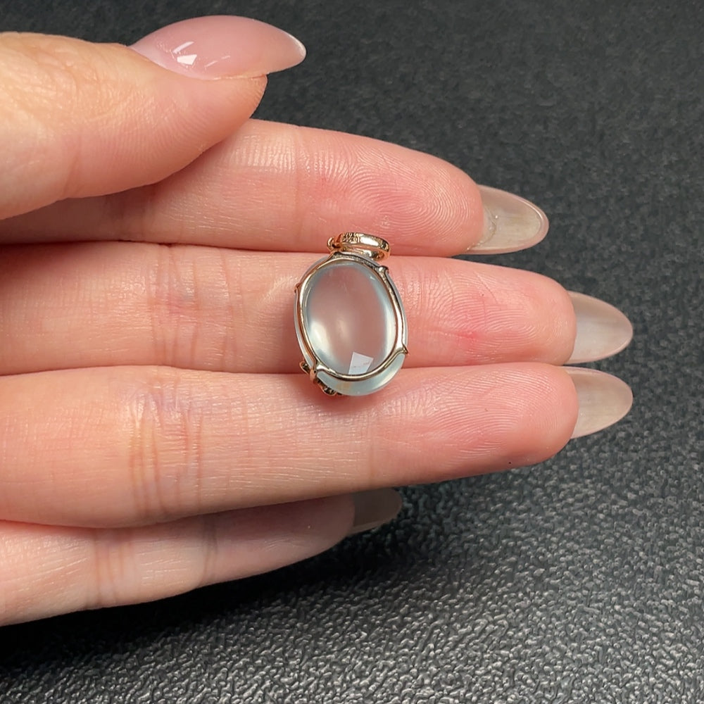 Huiliu Certified Prehnite pendant with diamond accents, showcasing a polished green gemstone and sparkling diamond details.