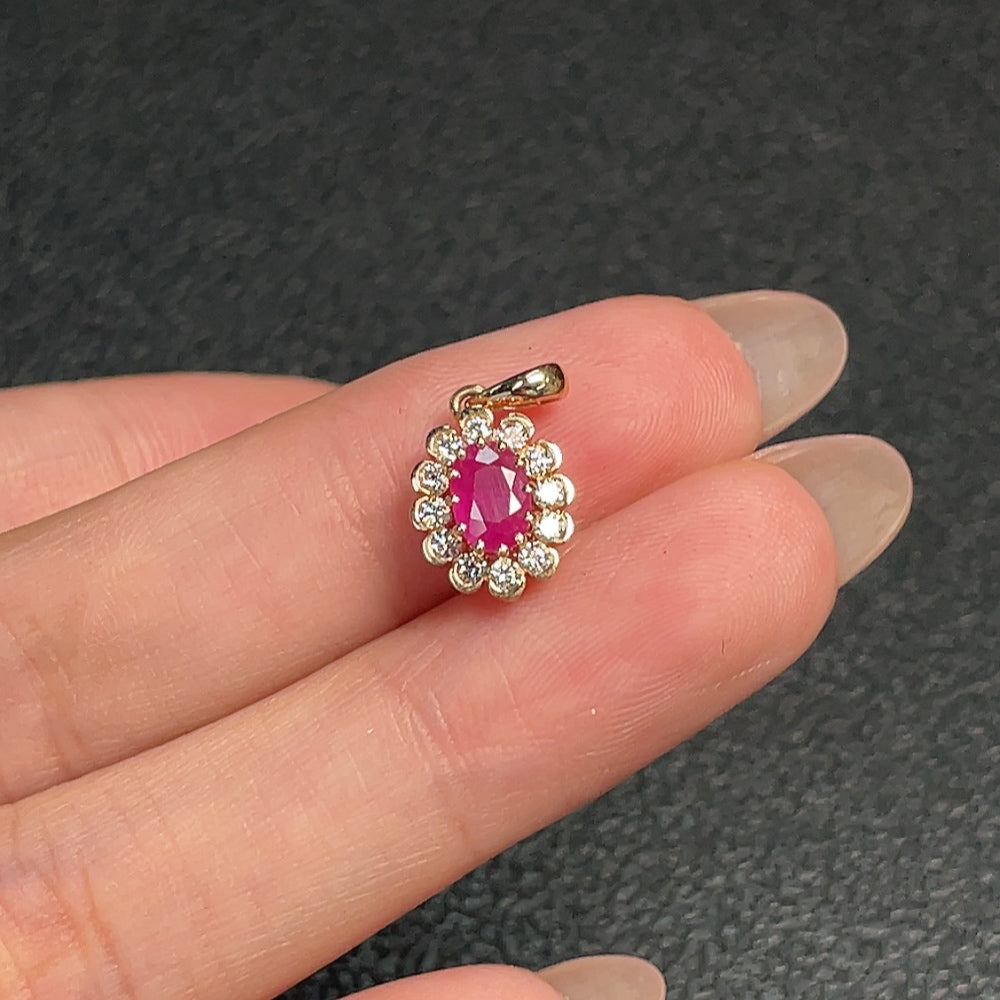 Ruby pendant in 18K gold with diamond accents, featuring a vibrant gemstone and delicate design from HUILIU HQ.